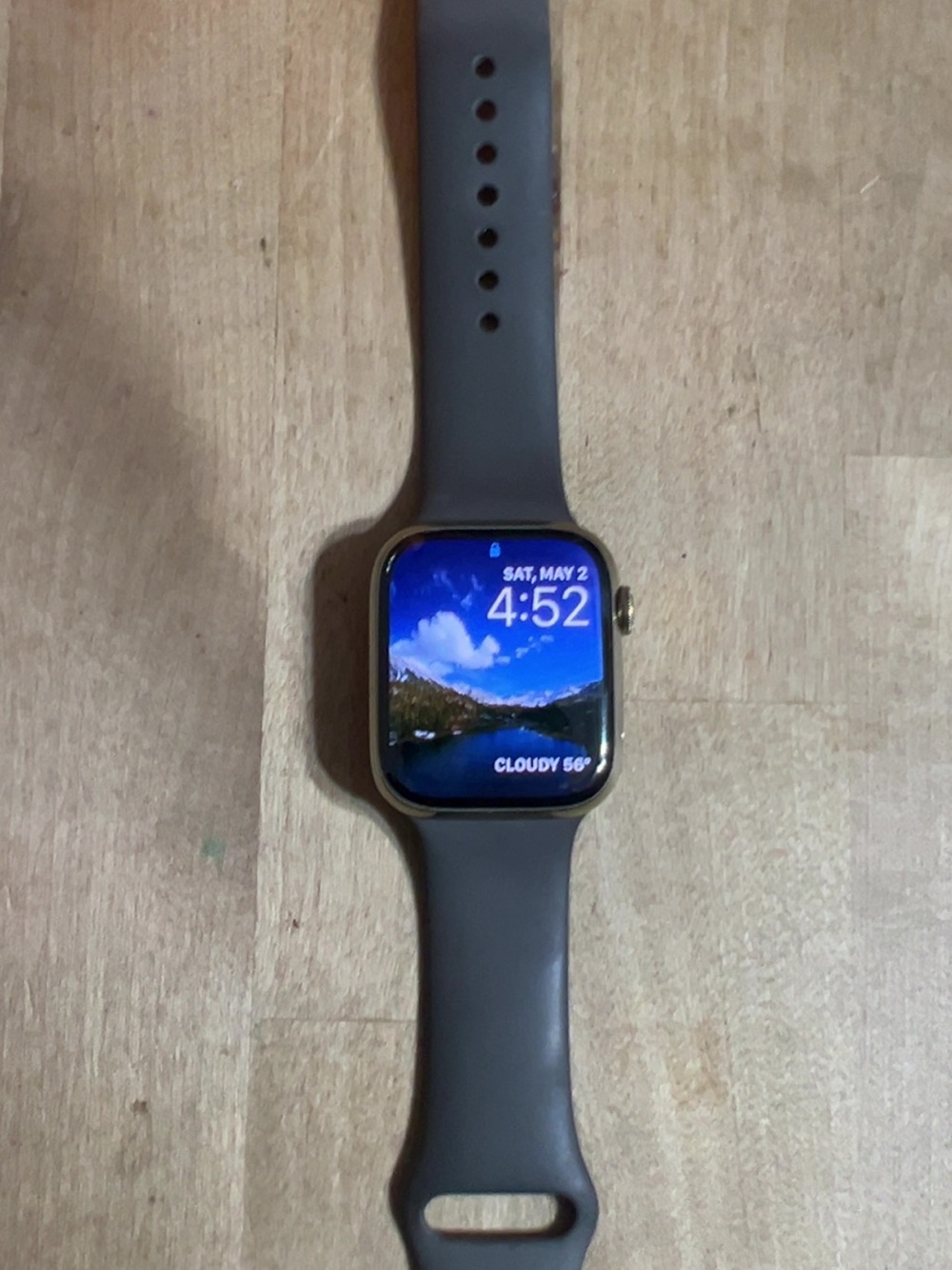 Apple Watch with Gray Sport Band and Gold Case